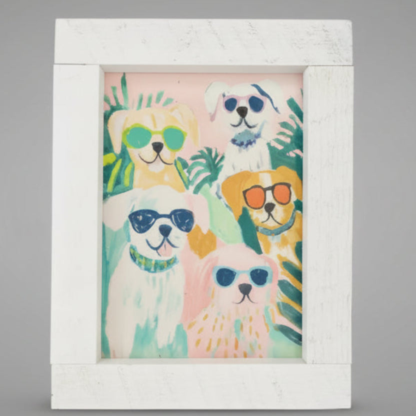 Framed artwork with colorful illustrations of dogs on a gray background